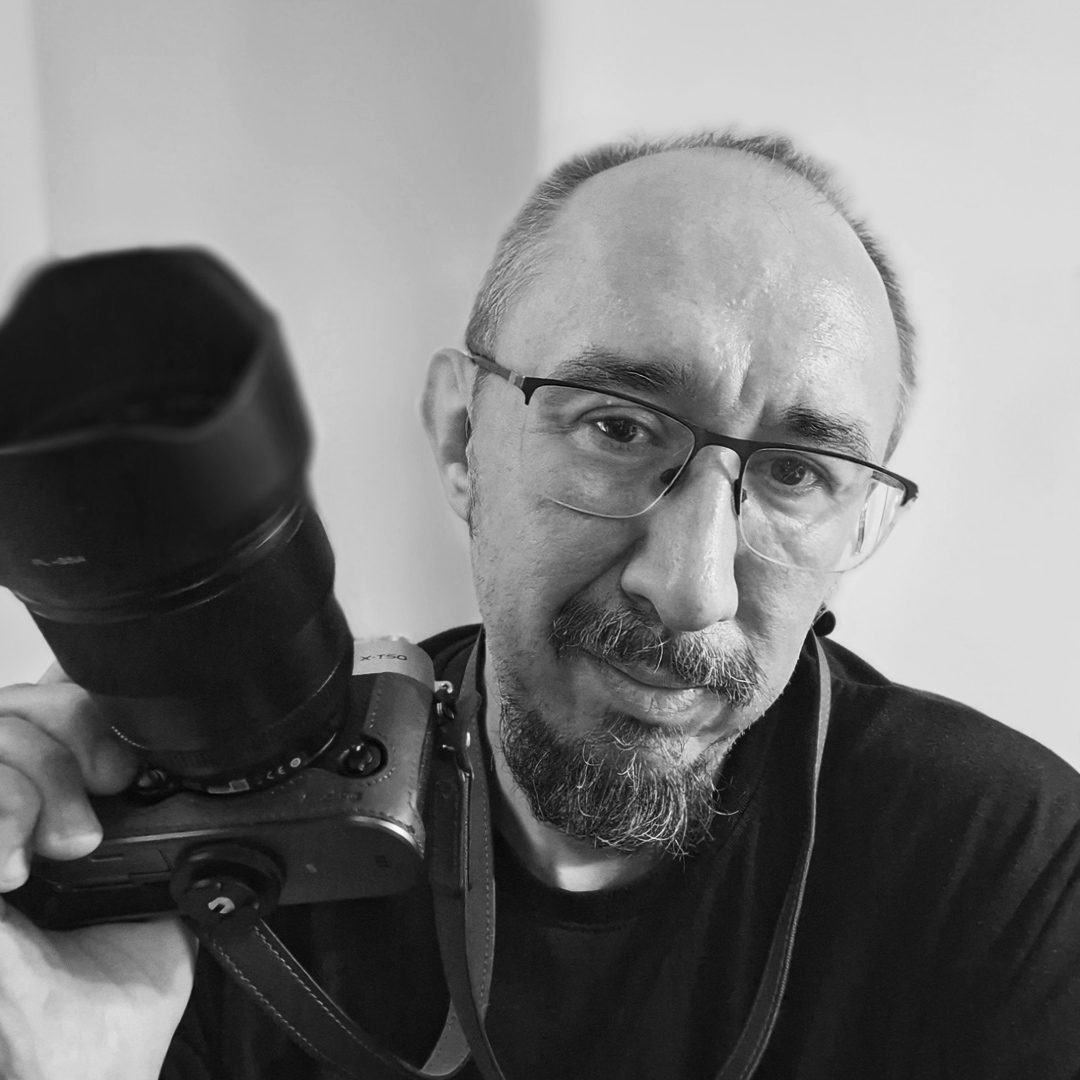 Self portrait of the photographer behind Rebel Shutter, black and white, vintage lens aesthetic