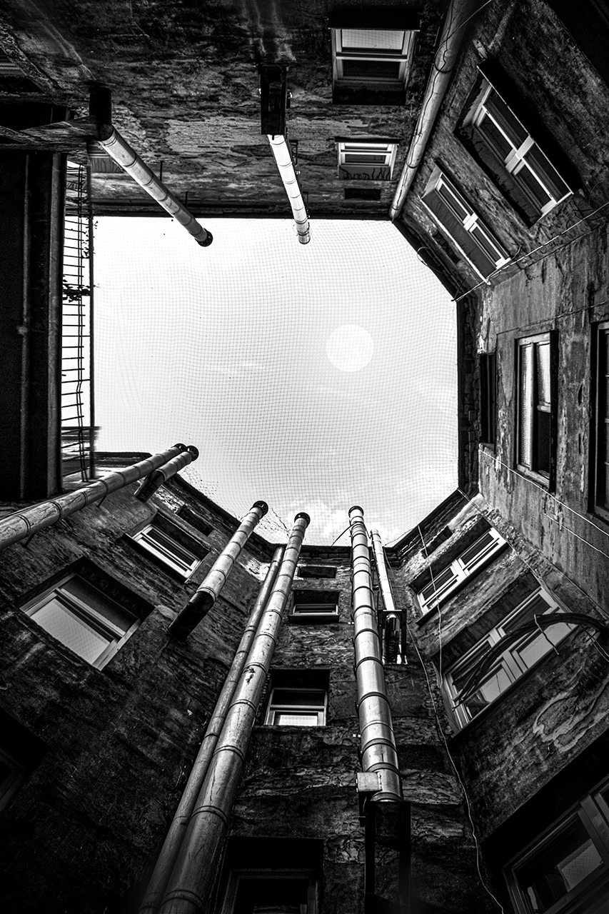 Evening sky seen from an inner courtyard of old tenement houses, Cracow, Poland.