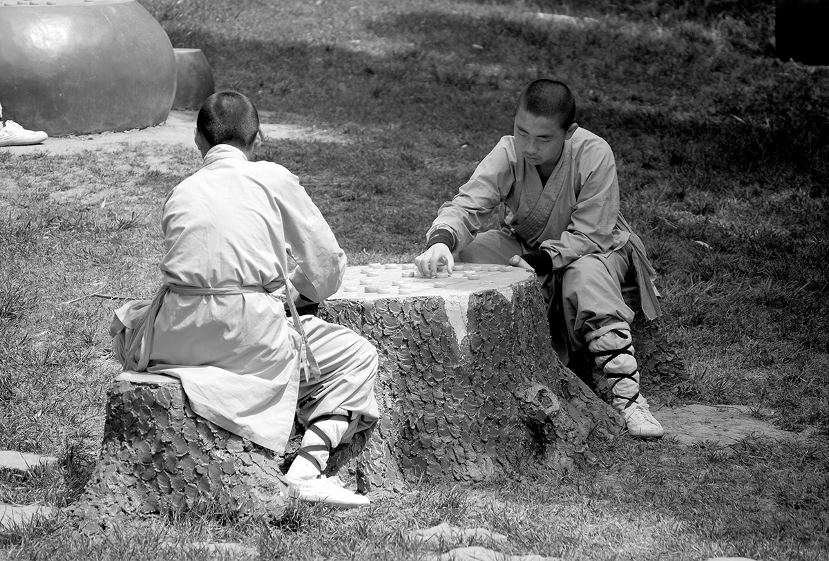 Short break of two Shaolin monks between workouts, Shaolin Temple, China.