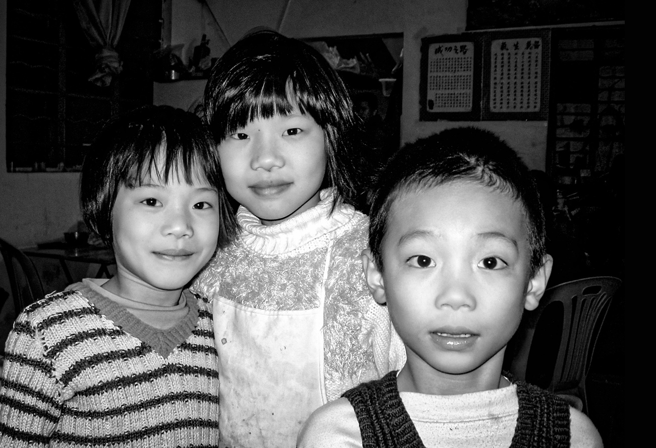 Siblings working together in a family restaurant in Guangzhou, China.