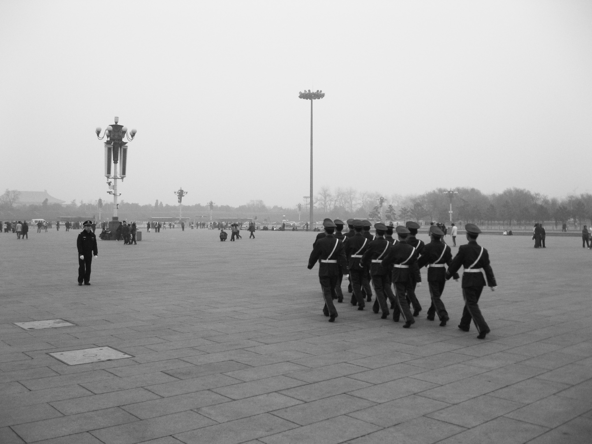 Soldiers marching across TienAnMen Square, Beijing, China.
